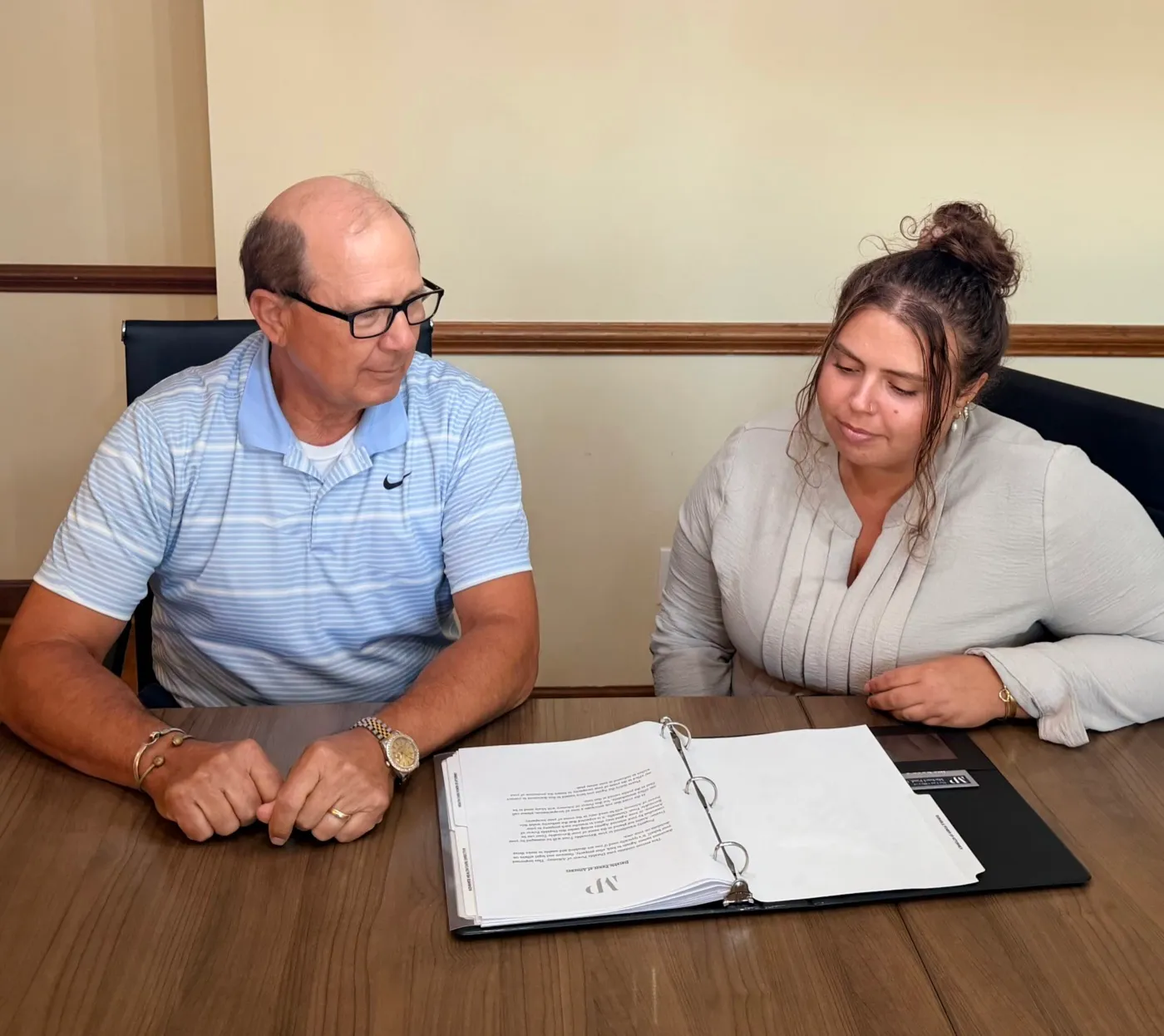 team members looking over paperwork