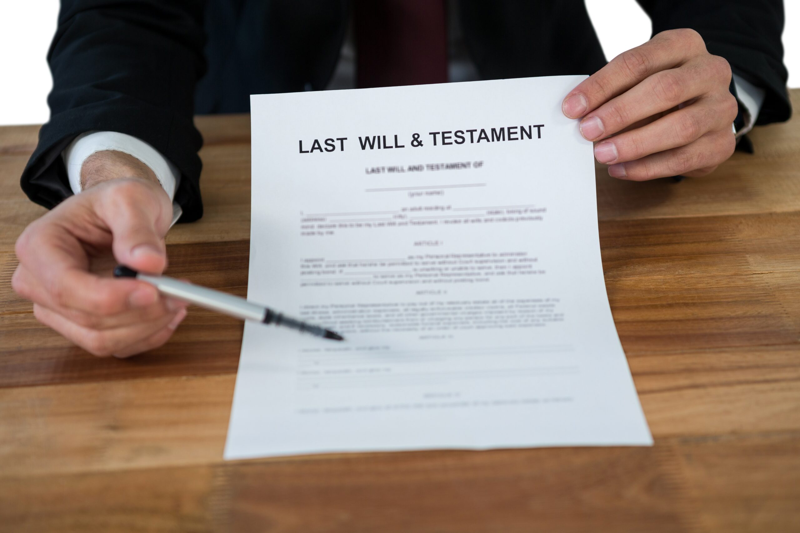 Mid section of businessman showing last will and testament form 828590